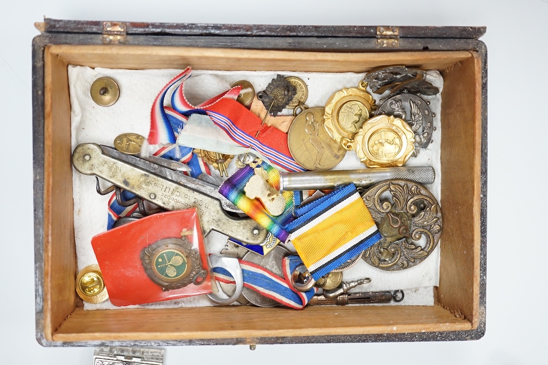 A quantity of assorted medals, an Essex crystal button, badges and ephemera